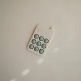 Игрушка сенсорная Mushie Pop-It Phone силиконовая, серо-зелёная, 1 шт Cambridge Blue 10m+ — фото 2