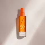 Мист солнцезащитный для тела Lancaster Sun Protective Water SPF 50 водная текстура с маслом бурити 150 мл — фото 7